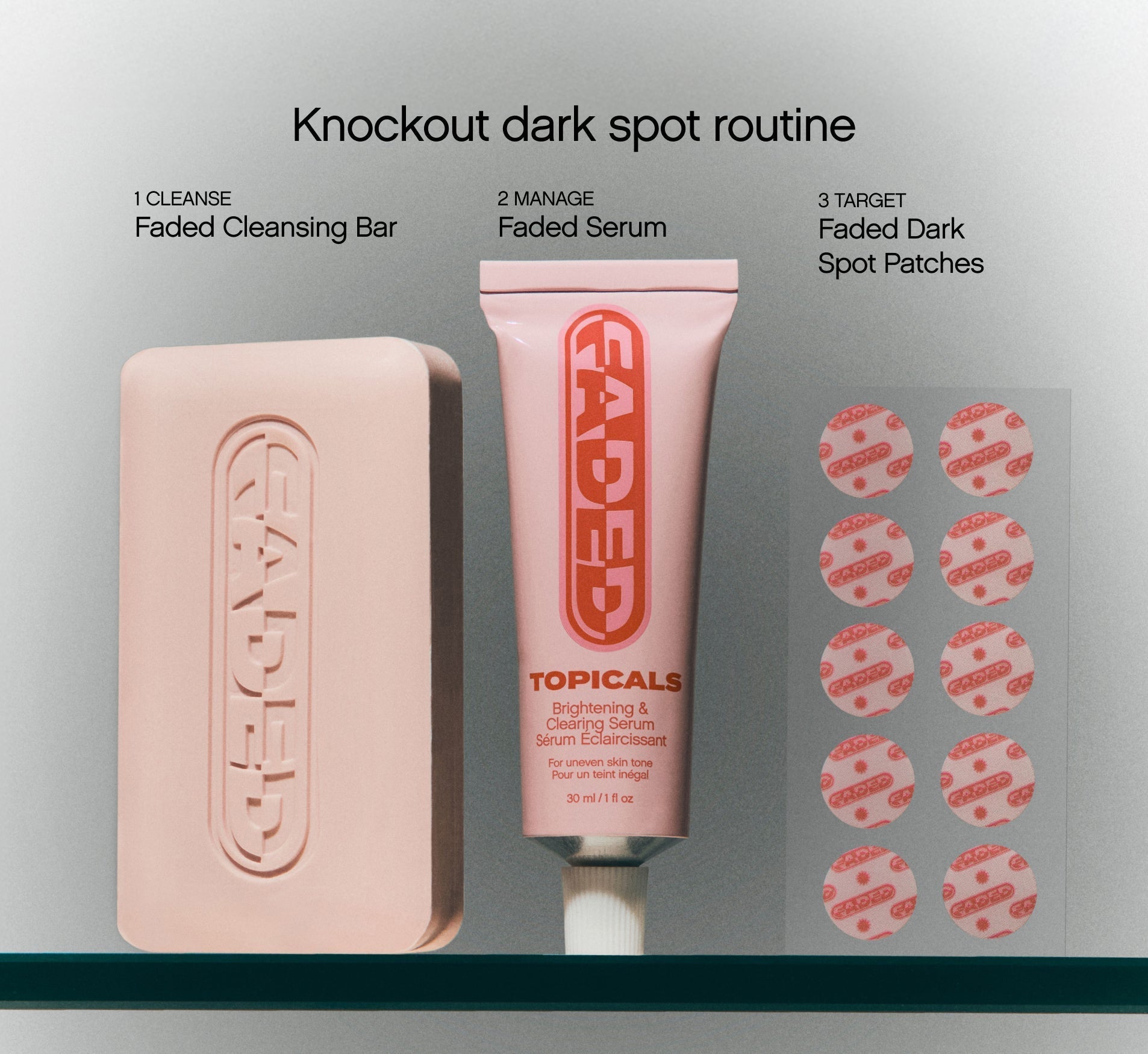 Brightening skincare three-step dark spot routine from Topicals Faded displaying the Cleansing Bar, Brightening & Clearing Serum, and Dark Spot Patches arranged on a glass shelf.
