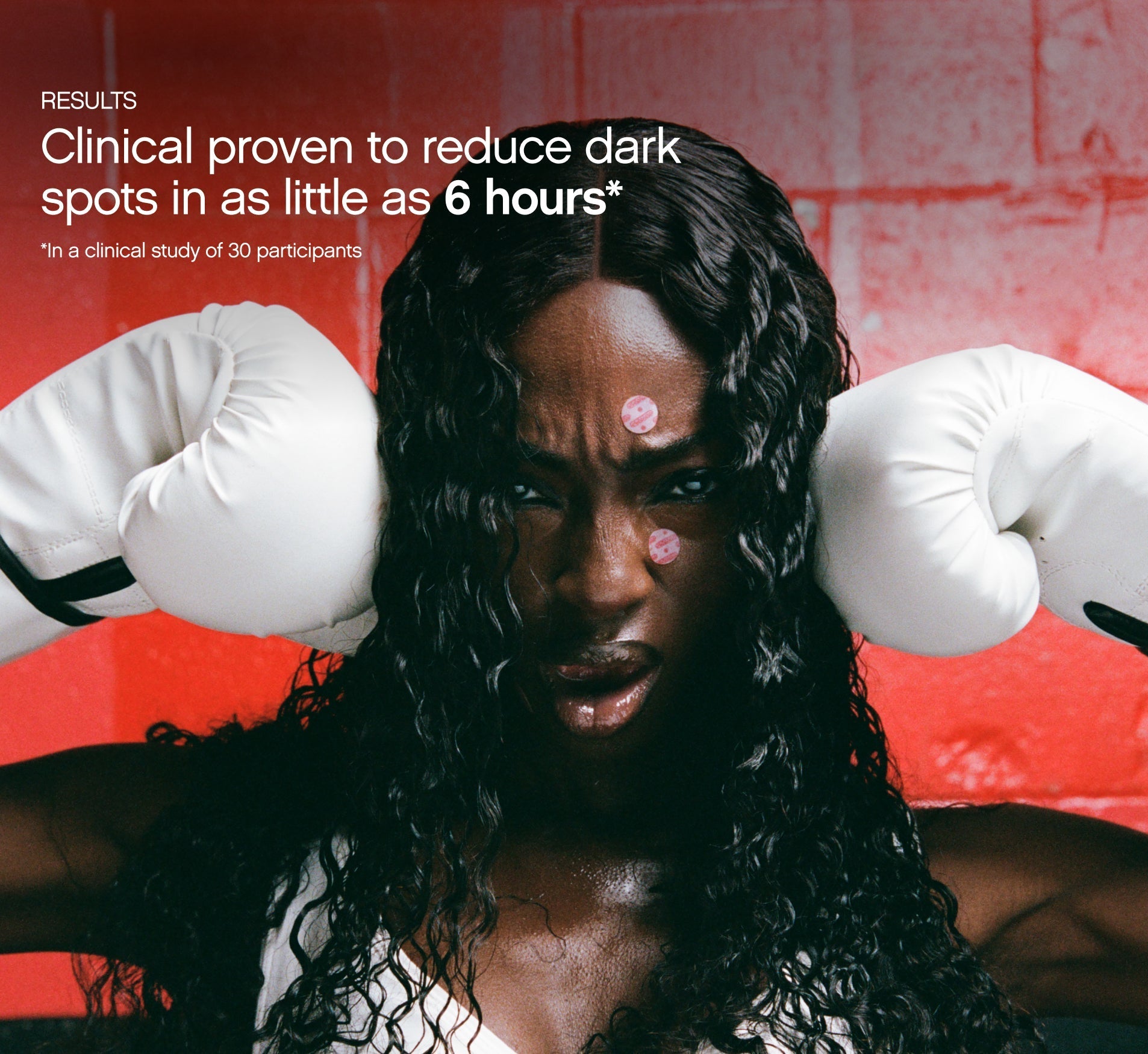 Dark spot remover for Black skin clinically proven results claim shown on a Black woman with box braids wearing white boxing gloves and Topicals Faded dark spot patches on her face.