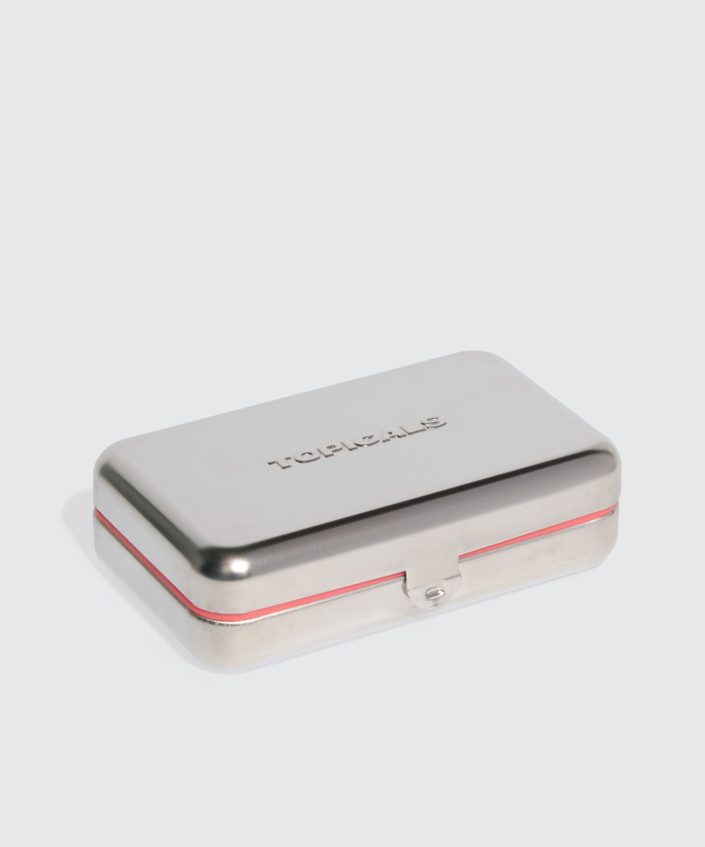 Closed Topicals stainless steel travel soap case with embossed branding and red rubber rim, designed to hold the Faded cleansing bar.