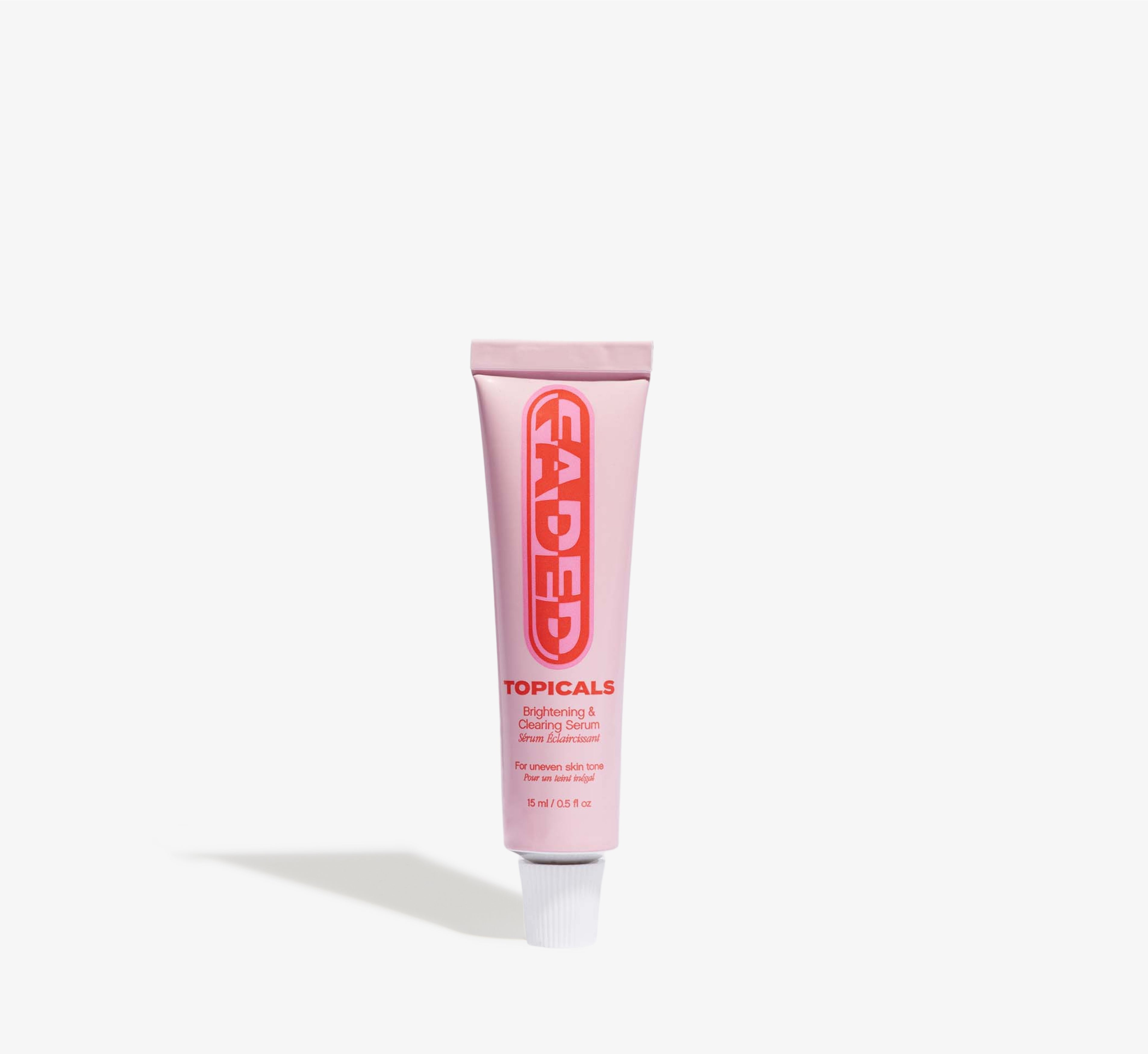 Clearing serum from Topicals Faded shown as a pink 15ml travel-size tube with bold red branding on a white background.