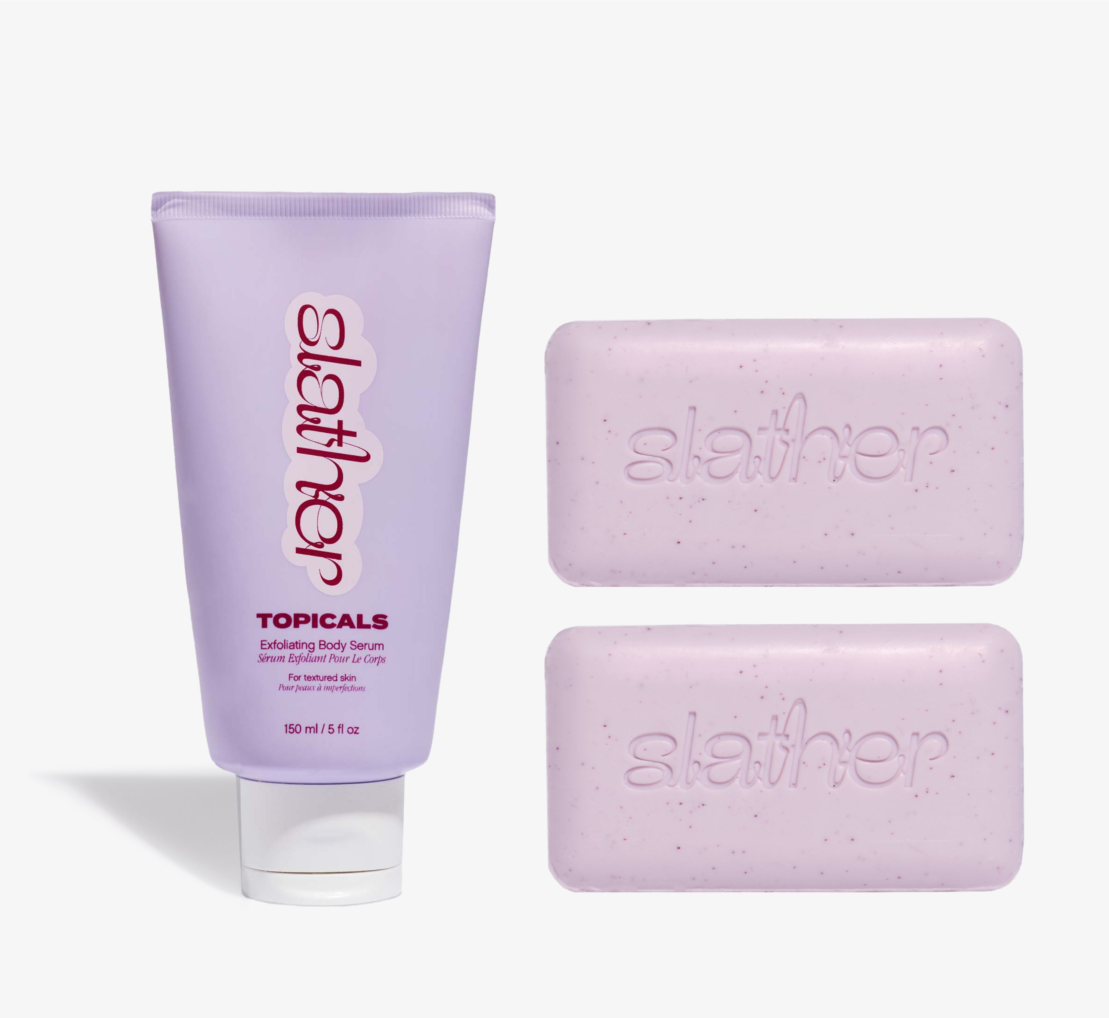 Exfoliating body care bundle from Topicals Slather featuring a lavender 150ml Exfoliating Body Serum tube alongside two pink Slather exfoliating cleansing bars on a white background.