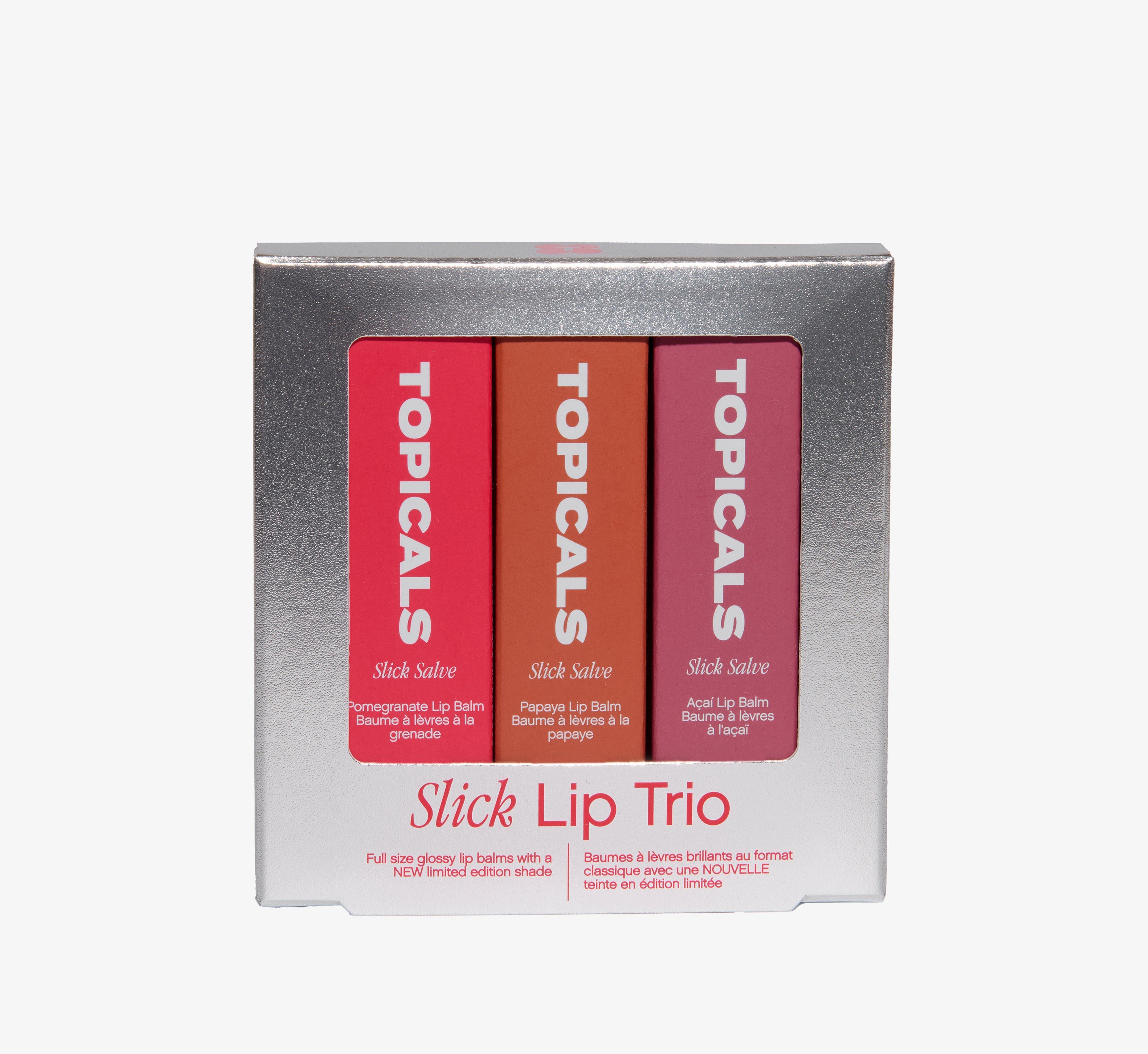 Lip balm gift set from Topicals Slick Salve featuring Pomegranate, Papaya, and Açaí shades displayed in a silver metallic Slick Lip Trio box on a white background.