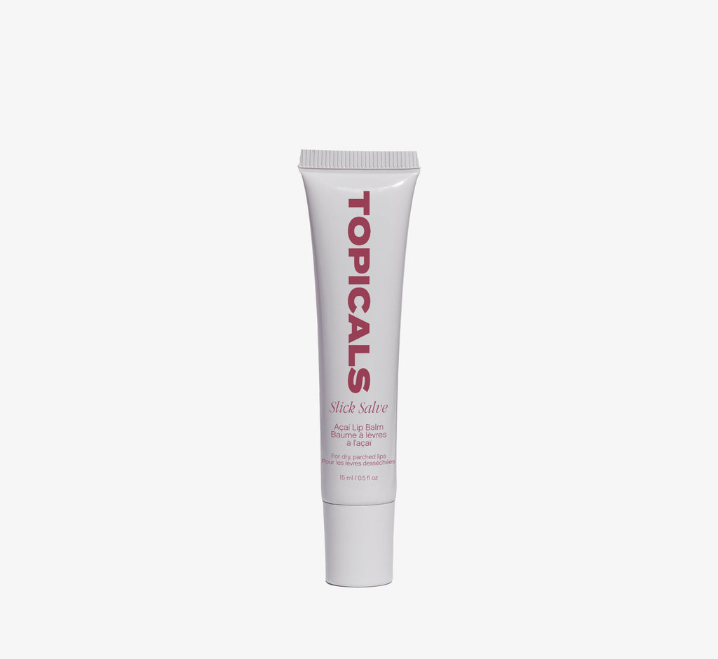 Açaí lip balm from Topicals Slick Salve shown as a single white 15ml squeeze tube with berry-toned branding on a white background.