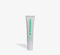 Mint lip balm from Topicals Slick Salve shown as a single white 15ml squeeze tube with green branding on a white background.